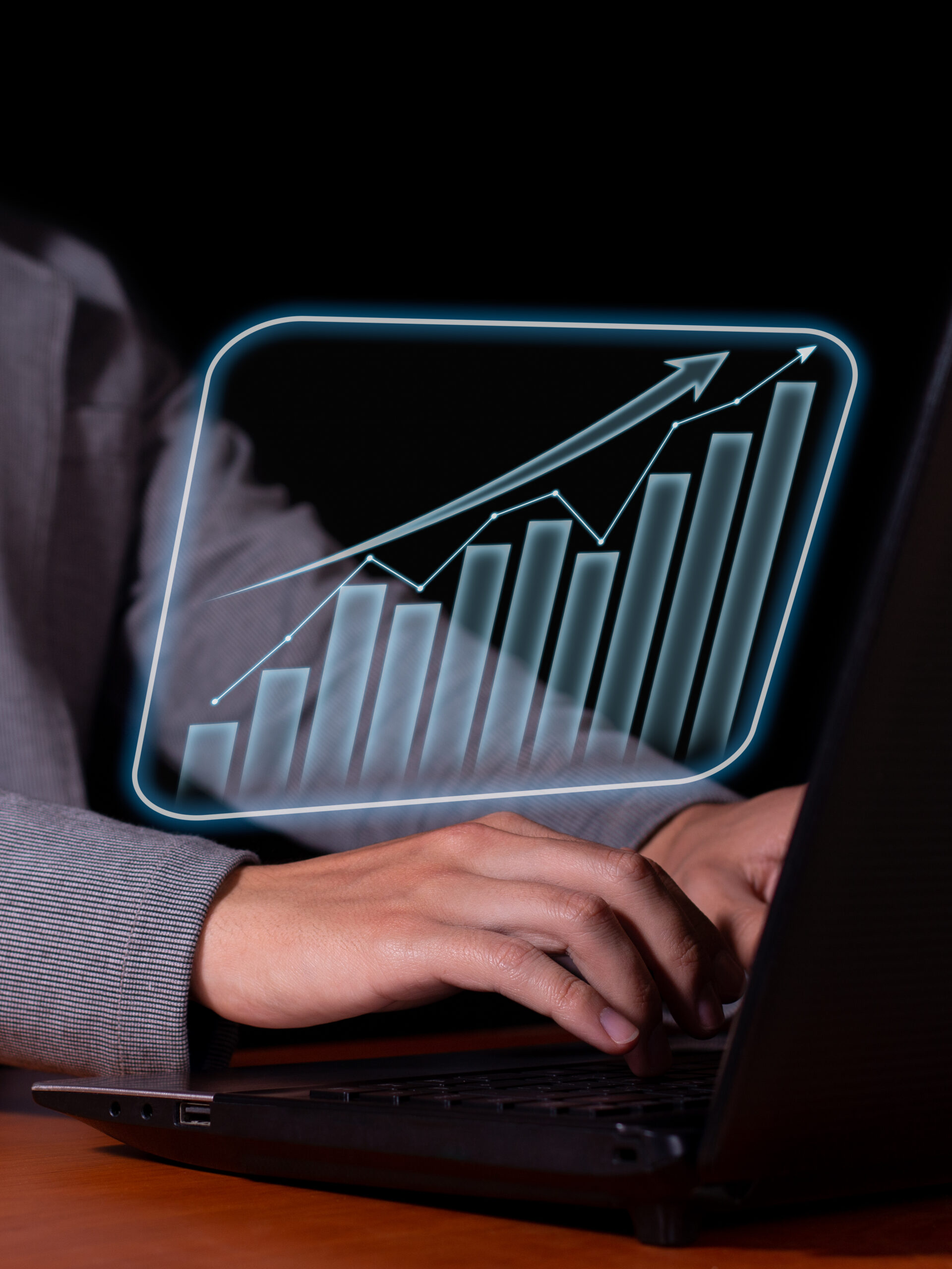 Vertical photo of Entrepreneur analyzes economic and financial growth. Investment chart and economic trends